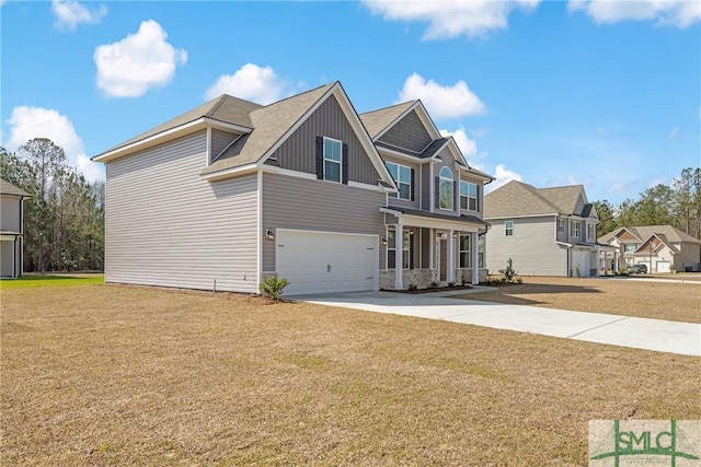 view of front of home with an attached garage, driveway, a front lawn, and board and batten siding