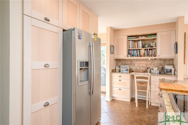 kitchen featuring stainless steel fridge with ice dispenser, tile patterned floors, decorative backsplash, a textured ceiling, and butcher block counters