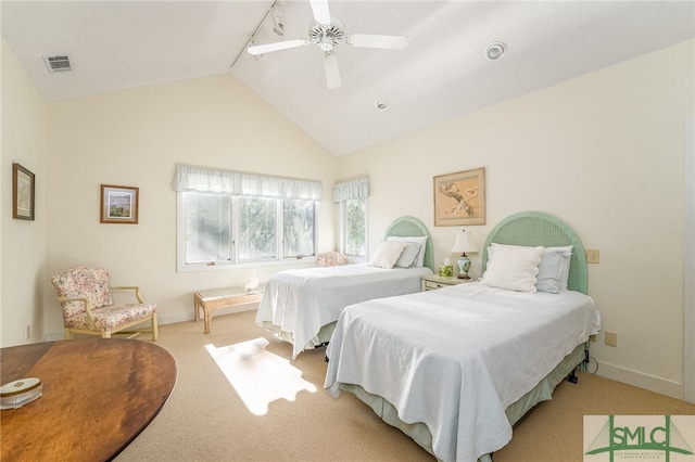 bedroom with vaulted ceiling, light colored carpet, and ceiling fan