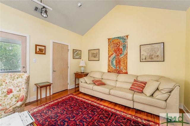 living room featuring hardwood / wood-style floors and lofted ceiling