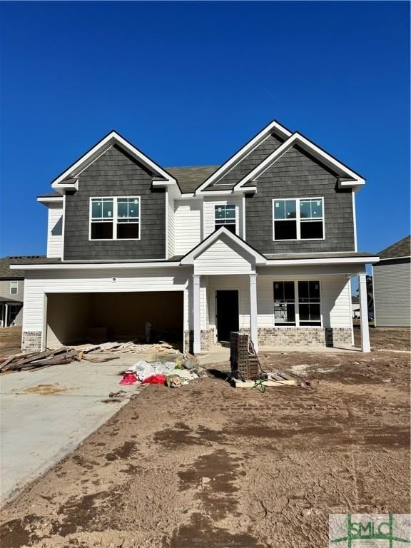 view of front of home with driveway and a garage