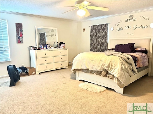 bedroom with a ceiling fan, light carpet, crown molding, and a textured ceiling