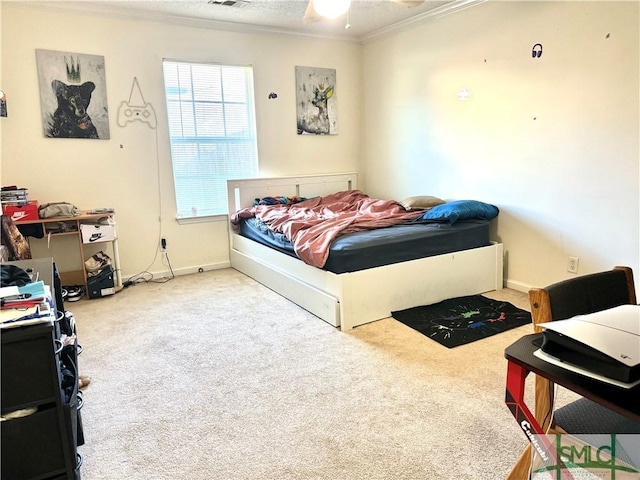 bedroom with ornamental molding, light colored carpet, visible vents, and baseboards