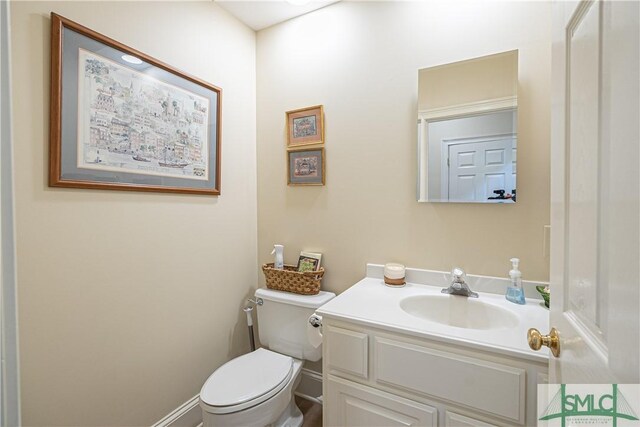 bathroom with toilet and vanity