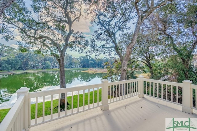 wooden deck with a water view