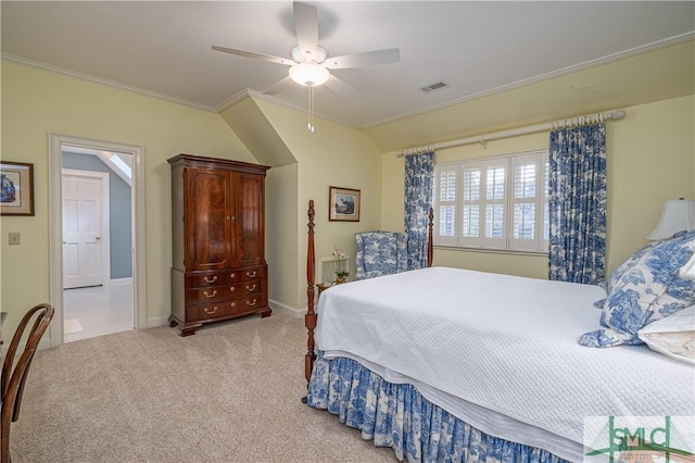 carpeted bedroom with ceiling fan and ornamental molding