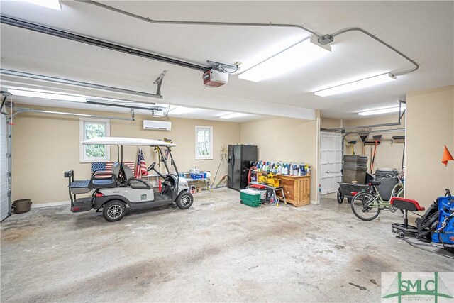 garage featuring a garage door opener and black fridge with ice dispenser