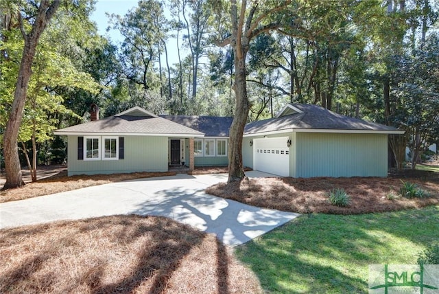 ranch-style house featuring a garage