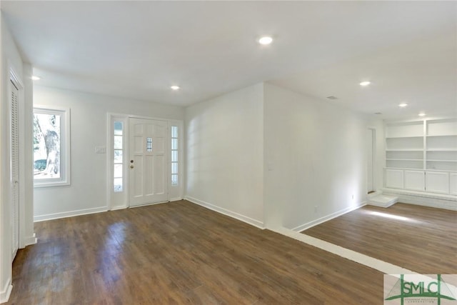 entryway with dark wood-type flooring