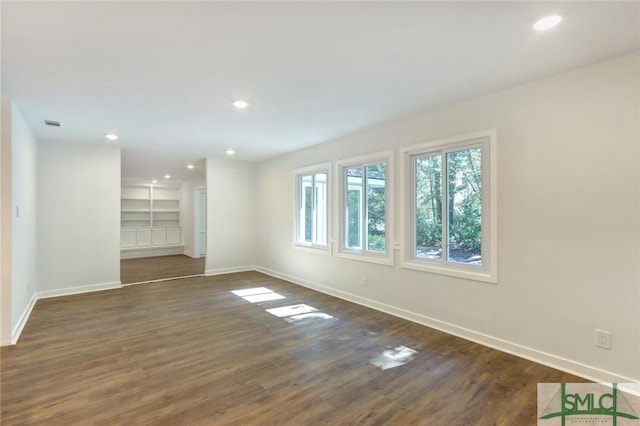 spare room featuring dark hardwood / wood-style flooring