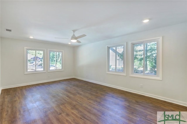 unfurnished room with dark wood-type flooring and ceiling fan