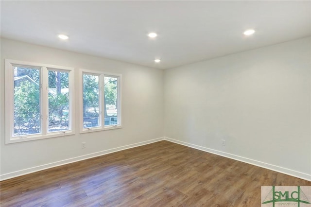 empty room featuring dark wood-type flooring