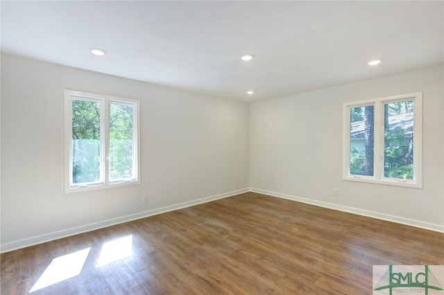 empty room featuring dark wood-type flooring