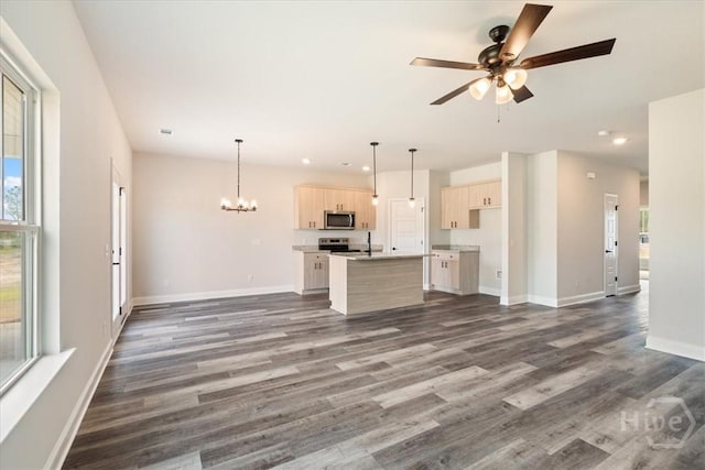 304 Timberlake Dr, Rincon, GA 31312 - unfurnished living room with dark wood-style flooring, a ceiling fan, baseboards, a chandelier, and recessed lighting