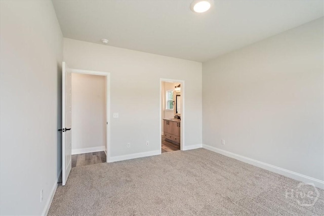 304 Timberlake Dr, Rincon, GA 31312 - unfurnished bedroom with carpet, baseboards, and ensuite bath