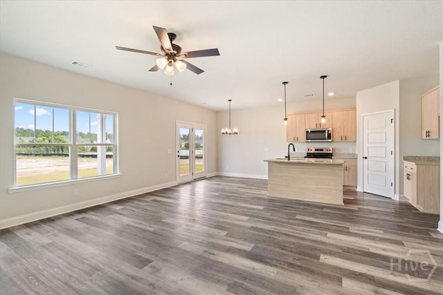 304 Timberlake Dr, Rincon, GA 31312 - unfurnished living room with ceiling fan, dark wood-style floors, a chandelier, baseboards, and recessed lighting
