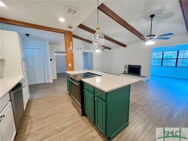 kitchen featuring stainless steel appliances, green cabinetry, white cabinetry, a kitchen island, and beam ceiling