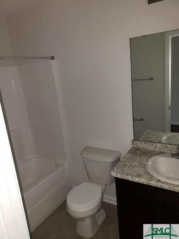 full bathroom featuring shower / bathing tub combination, tile patterned flooring, vanity, and toilet