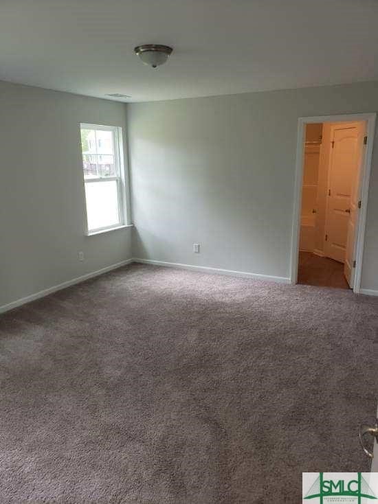 empty room with carpet flooring