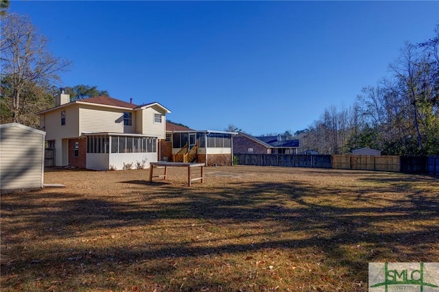 view of yard with a sunroom