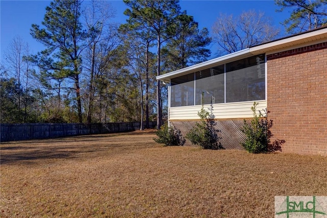 view of yard featuring a sunroom