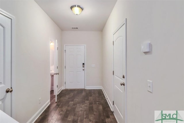 hall with dark hardwood / wood-style flooring