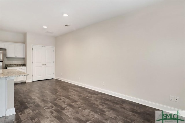 interior space with dark wood-type flooring