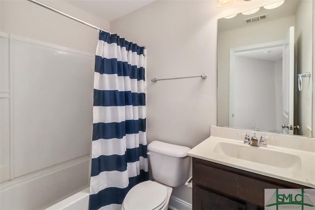 full bathroom with vanity, shower / bath combo with shower curtain, and toilet