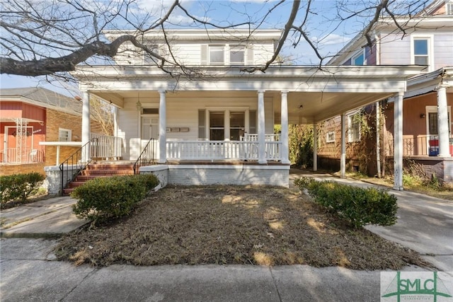 country-style home featuring covered porch