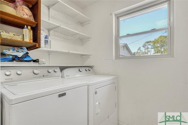 laundry area featuring plenty of natural light and independent washer and dryer