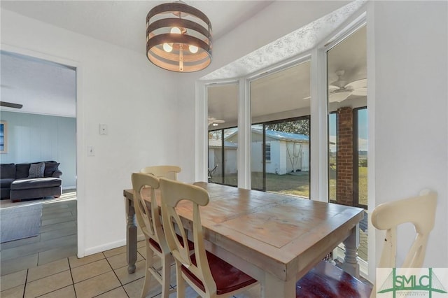 tiled dining room with ceiling fan