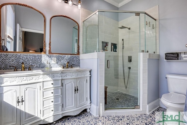 bathroom with ornamental molding, tile patterned flooring, tasteful backsplash, and a shower with shower door