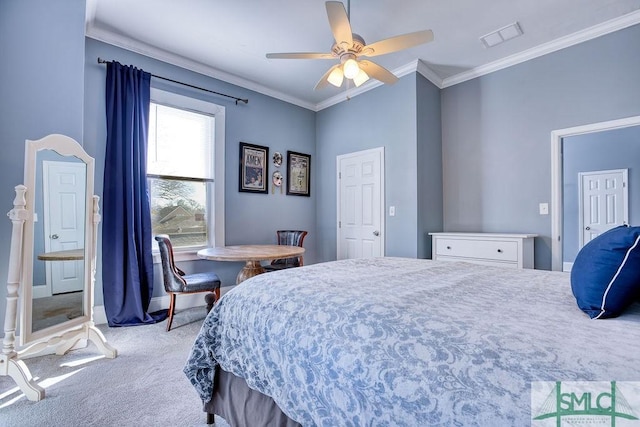 carpeted bedroom with ceiling fan and crown molding