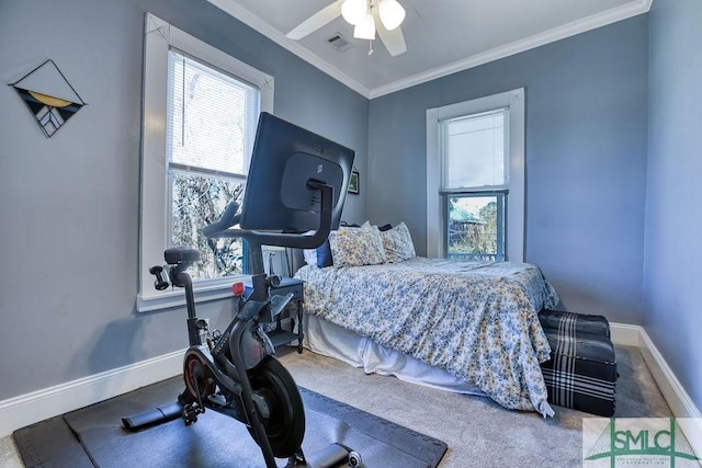 bedroom with ornamental molding and ceiling fan