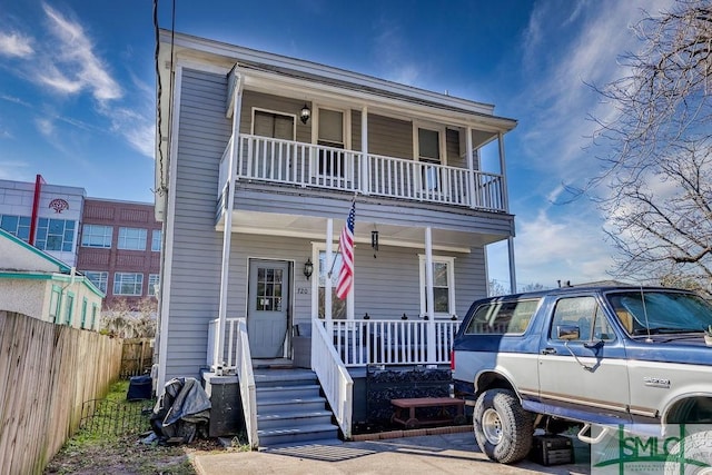 view of front facade with a porch and a balcony