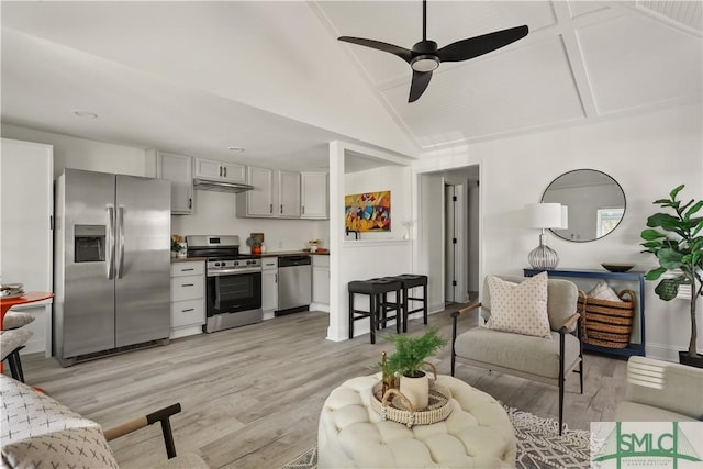 living room with lofted ceiling, ceiling fan, and light hardwood / wood-style flooring