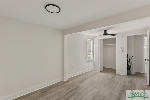 unfurnished bedroom featuring ceiling fan, light hardwood / wood-style flooring, and a closet