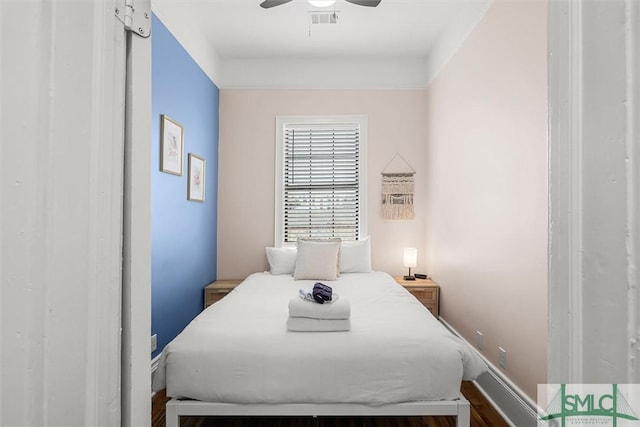 bedroom featuring ceiling fan and wood-type flooring