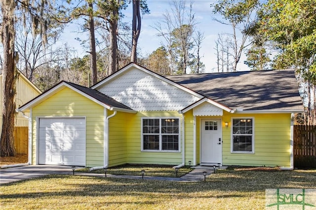 single story home featuring a front lawn and a garage