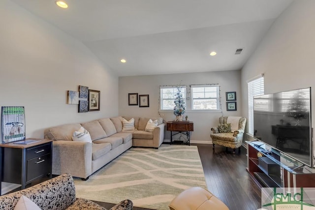 living room featuring lofted ceiling and dark hardwood / wood-style floors