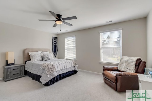 bedroom featuring ceiling fan and light carpet