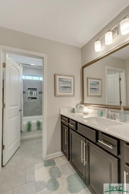 bathroom with tile patterned floors and vanity