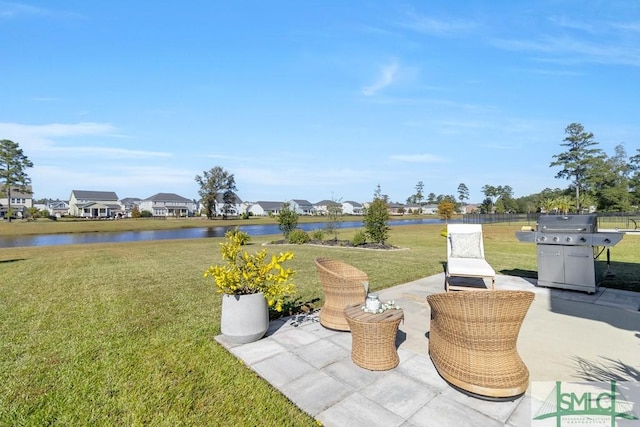 view of patio / terrace with a grill and a water view