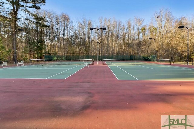 view of tennis court featuring basketball court