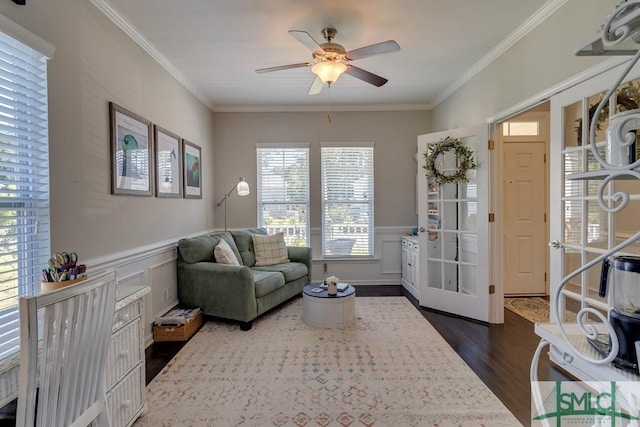 living room with ceiling fan, crown molding, and dark hardwood / wood-style flooring