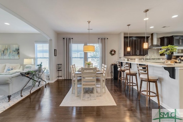 dining space featuring dark hardwood / wood-style flooring