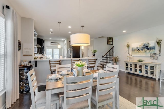 dining area featuring dark wood-type flooring