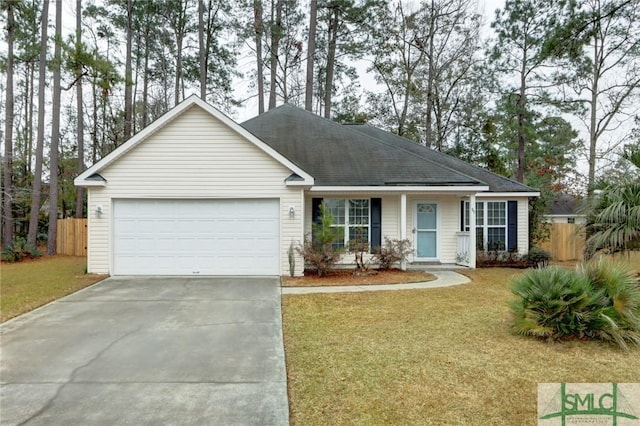 ranch-style house featuring a front yard and a garage