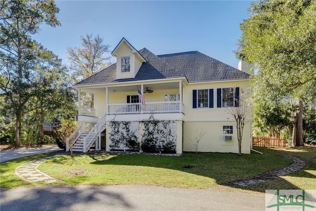 view of front of house with a front yard and a porch