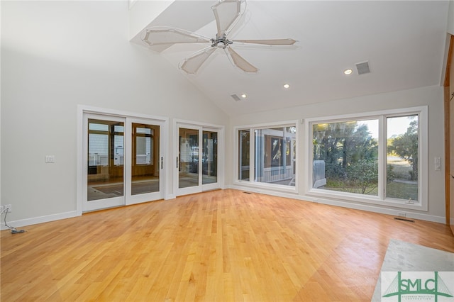 unfurnished sunroom with vaulted ceiling and ceiling fan